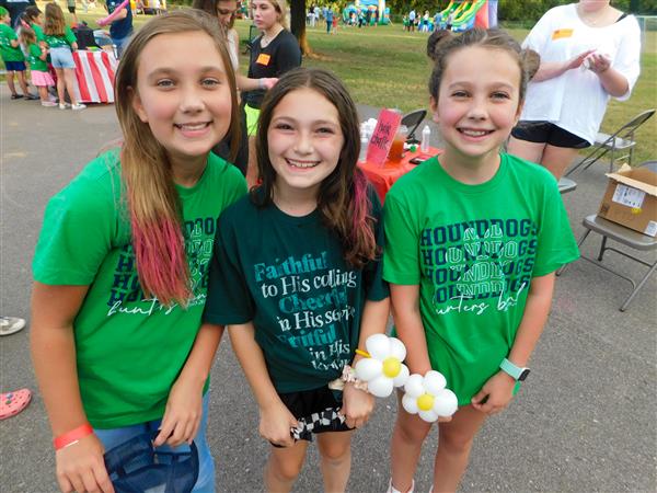 Students outside enjoying a family fun night for their school.